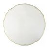 large round wall mirror with a fluted gold metal slim frame