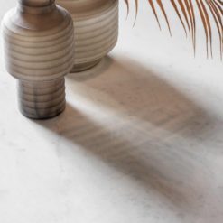 rectangular dining table with curved metal framed legs and white marble top