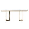 rectangular dining table with gold curved metal framed legs and white marble top