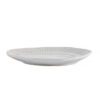 set of four off-white porcelain side plates with an uneven rustic shape and ribbed edging