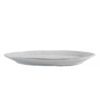 off-white porcelain serving platter with an uneven rustic shape and ribbed edging