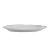 off-white porcelain serving platter with an uneven rustic shape and beaded edging