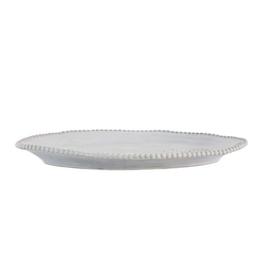 off-white porcelain serving platter with an uneven rustic shape and beaded edging