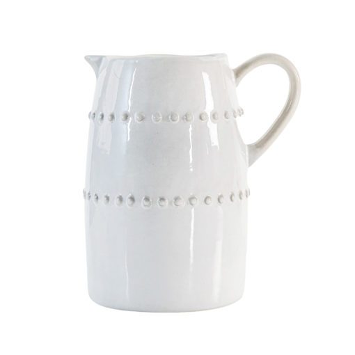 off-white porcelain jug with an uneven rustic shape and beaded design