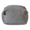 plump square light grey velvet pouffe with piped edging and tassel corners