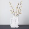 large contemporary white procelain faces vase