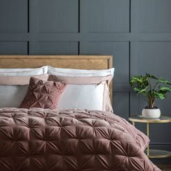 cotton velvet quilted pin-tucked bedspread in blush pink wth a natural cotton linen mix reverse