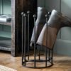 round wellington boot stand with eight spokes to store four sets of boots