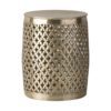 drum shaped round metal side table with a fretwork surround and hammered top finished in a lightly distressed pale gold