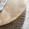 drum shaped round metal coffee table with a fretwork surround and hammered top finished in a lightly distressed pale gold