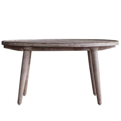 round natural wooden coffee table with an ornately carved top and white-wash finish