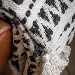 black and cream patterned cream throw with tassels