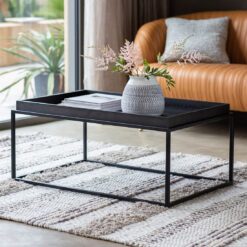 rectangular black metal framed coffee table with a wooden tray table top