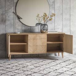 oak sideboard with a chevron inlay pattern to front with two cupboards, three drawers and tapered legs