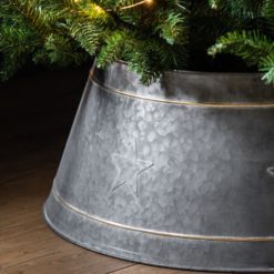 antique silver metal christmas tree skirt available in two sizes with embossed star design