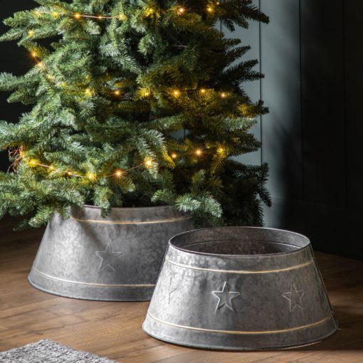 antique silver metal christmas tree skirt available in two sizes with embossed star design