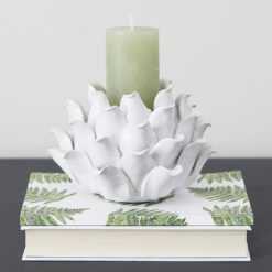 ceramic candle holder in the shape of a flower with layers of petals and a central opening for a pillar candle or tealight