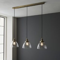 Three Pendant Linear Ceiling Light with glass domed shades and antique brass fittings