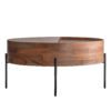round wooden coffee table with iron rod legs and a revolving top concealing storage space within the table