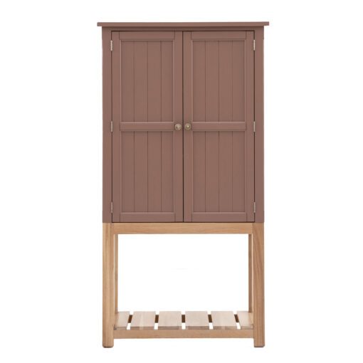 tall two-door storage cupboard sat on an open oak frame with slatted shelf with panelled doors painted in a deep blush pink