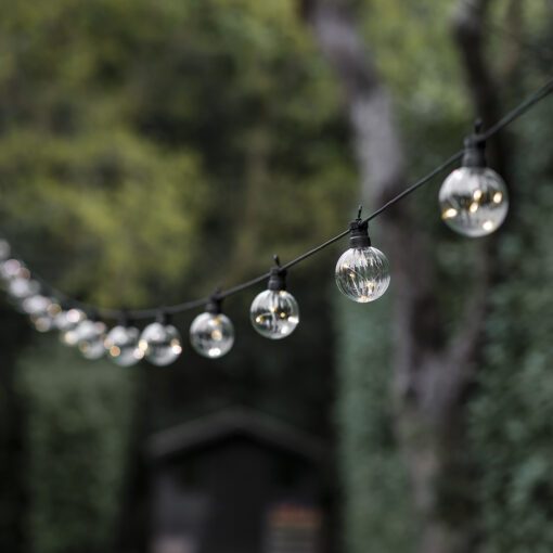 ribbed golf ball shaped, clear bulb, black festoon lights available in two lengths of 10 and 20 bulbs