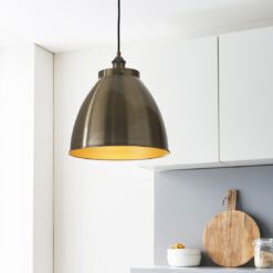 retro style domed pendant light with a brass plated finish and black flex cord