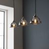 silver linear light with three domed pendant lights with a smokey mirrored tint, nickel plated fittings and black cord