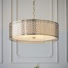 luxe gold pendant light with fretwork drum lampshade and chain cord