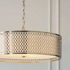 luxe gold pendant light with fretwork drum lampshade and chain cord