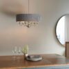 polished silver nickel six arm pendant light complete with round grey pleated lampshade