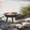 cast iron round fire pits available in three sizes with two carry handles and four sturdy legs