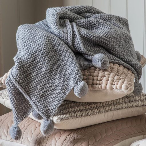 moss stitched charcoal grey knitted throw with pom pom edging