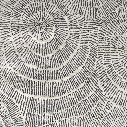 rectangular cream rug with a striking inky grey swirly starburst design