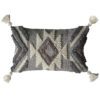 textured grey and natural rectangular cushion with a chunky aztec design and large cream corner pom poms