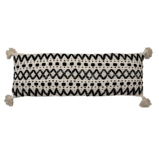 black and cream rectangular bolster cushion with a bold aztec pattern and four large cream corner pom poms