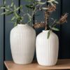 large white glass vases with a ribbed detailing available in two sizes