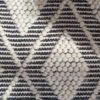 handwoven black and cream rectangular rug with a contrasting diamond pattern available in three sizes