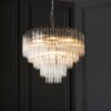 large art deco style twelve pendant chandelier with layers of clear glass ribbed glass tubes suspended from a silver steel frame and adjustable chain