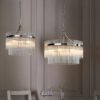 round silver chandelier pendant light with layers of clear glass vertical rods suspended from a metal frame available in two sizes