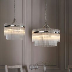 round silver chandelier pendant light with layers of clear glass vertical rods suspended from a metal frame available in two sizes