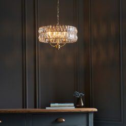 silver plated drum pendant lights available in two sizes with clear glass faceted shades and adjustable chains