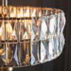 silver plated drum pendant lights available in two sizes with clear glass faceted shades and adjustable chains
