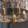 antique brass plated drum pendant lights available in two sizes with clear glass faceted shades and adjustable chains