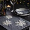 dark grey cotton table runners in two sizes with a large embroidered white snowflake and blanket stitching