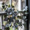 leafy christmas garland with faux foliage and pine cones