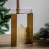 gold metal rectangular candle holder with a central cut-out townhouse design