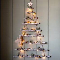 rustic christmas tree wall hanging crafted from twigs decorated with led lights, pine cones and stars