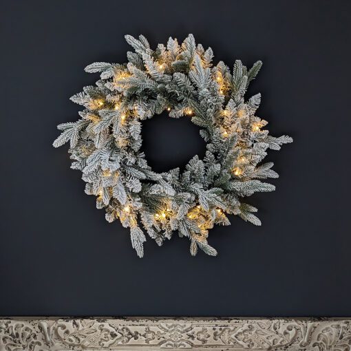 pre-lit oversized large faux pine christmas wreath with a frosted finish and warm-white LED lights