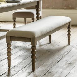 handcrafted oak dining bench with turned bobbin legs and a natural upholstered seat pad