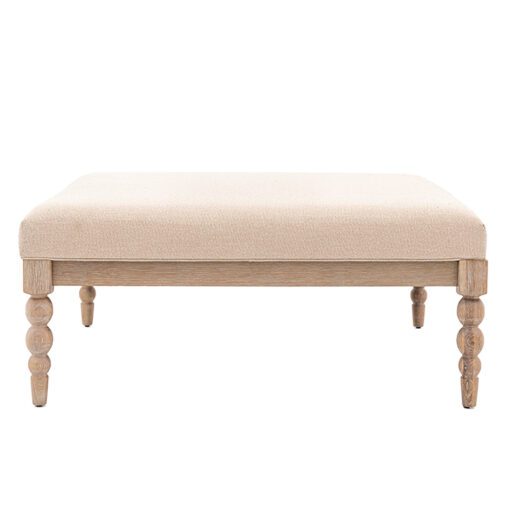 handcrafted square oak coffee table with bobbin turned legs and a natural upholstered top